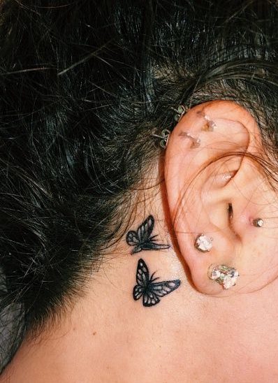 small butterfly ear tattoo